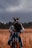 woman standing in the middle of wheat field