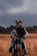 woman standing in the middle of wheat field