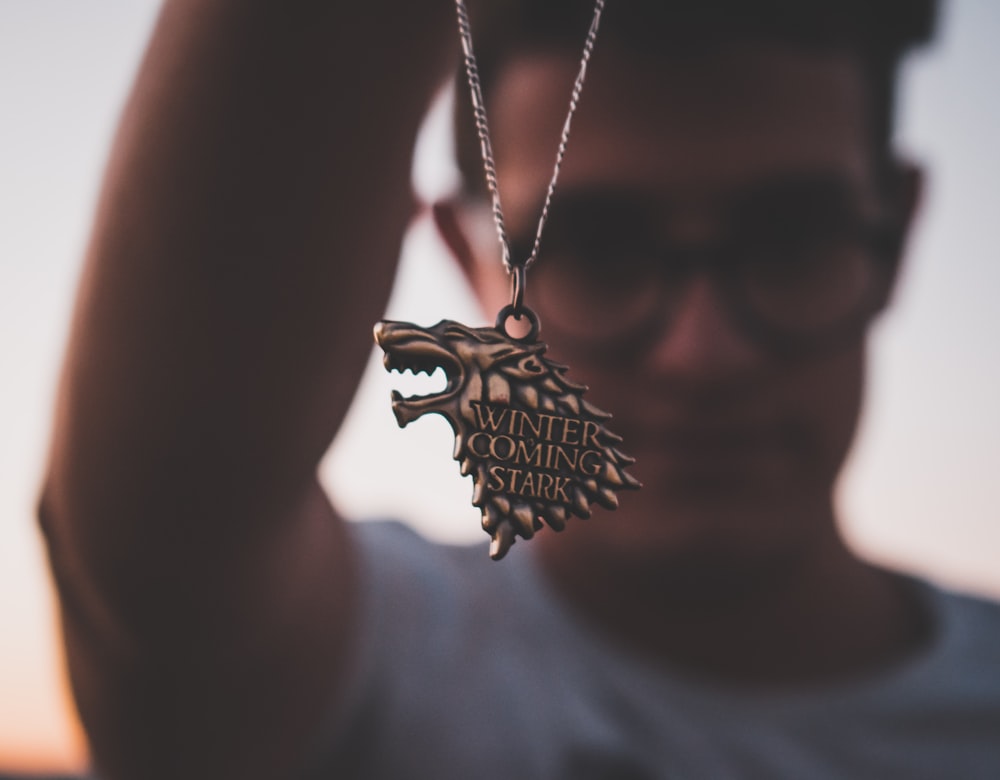 silver-colored Winter Coming Stark pendant necklace