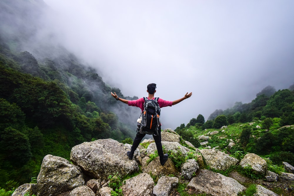 man standing on mountain