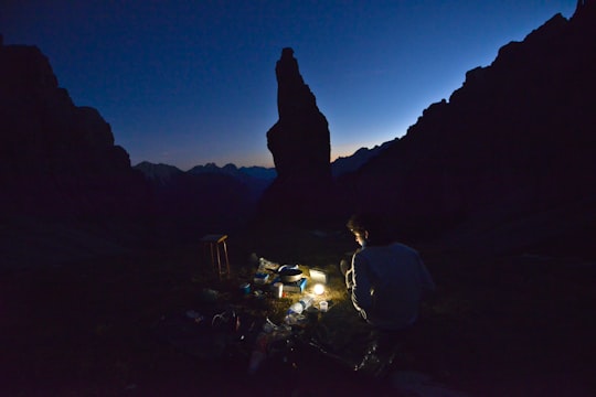 man using light during nighttime in Erto e Casso Italy