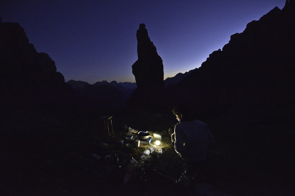 man using light during nighttime