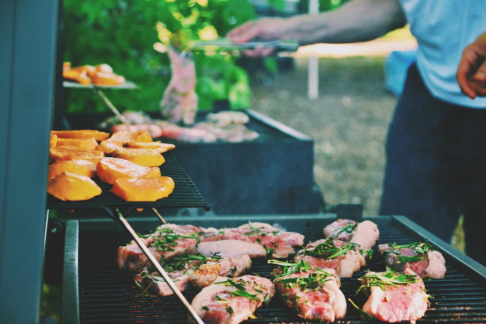 person grilling meat