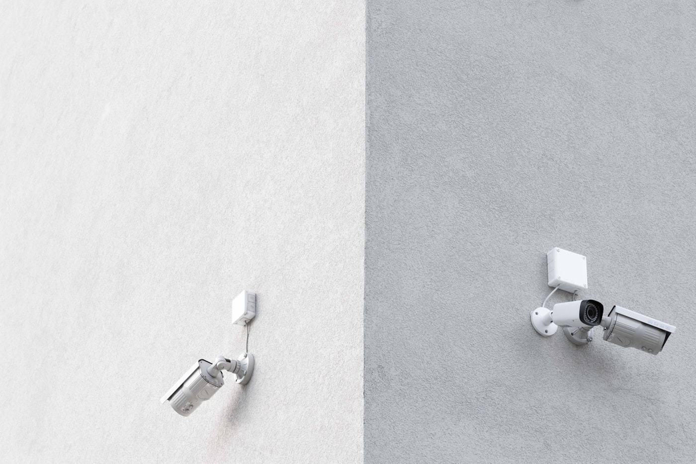 Three CCTV cameras mounted on an exterior wall