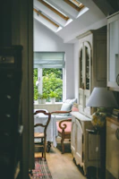 A cozy Scandinavian-style dining setup with natural light highlighting a rustic artisan dish.