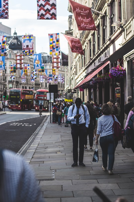 people walking beside the street in Regent Street United Kingdom