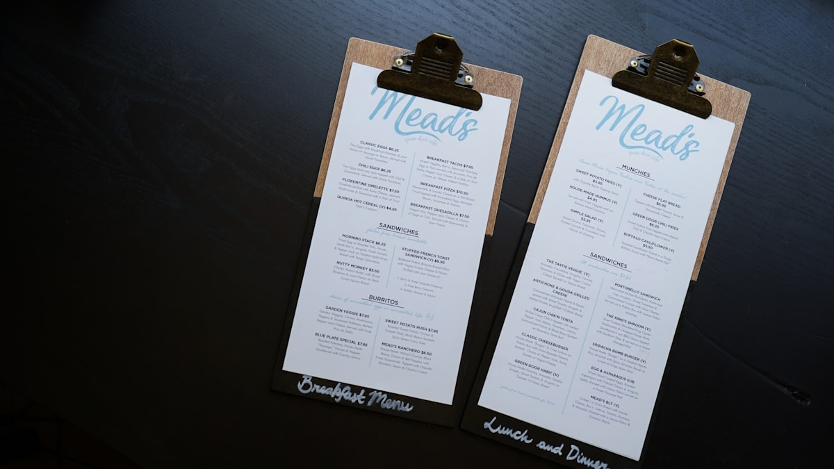 Printed documents fastened with binder clips on a desk