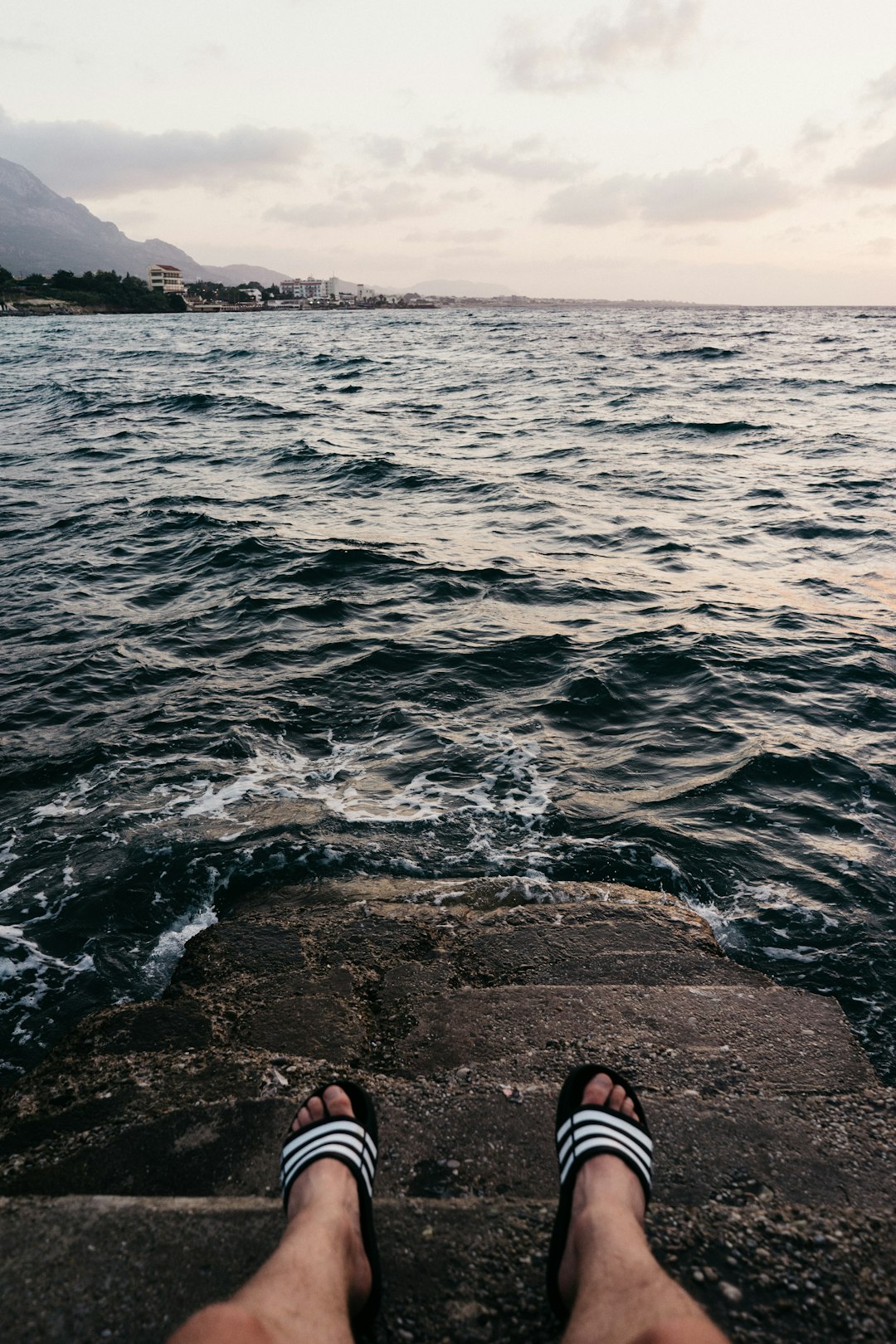 person sitting on dock