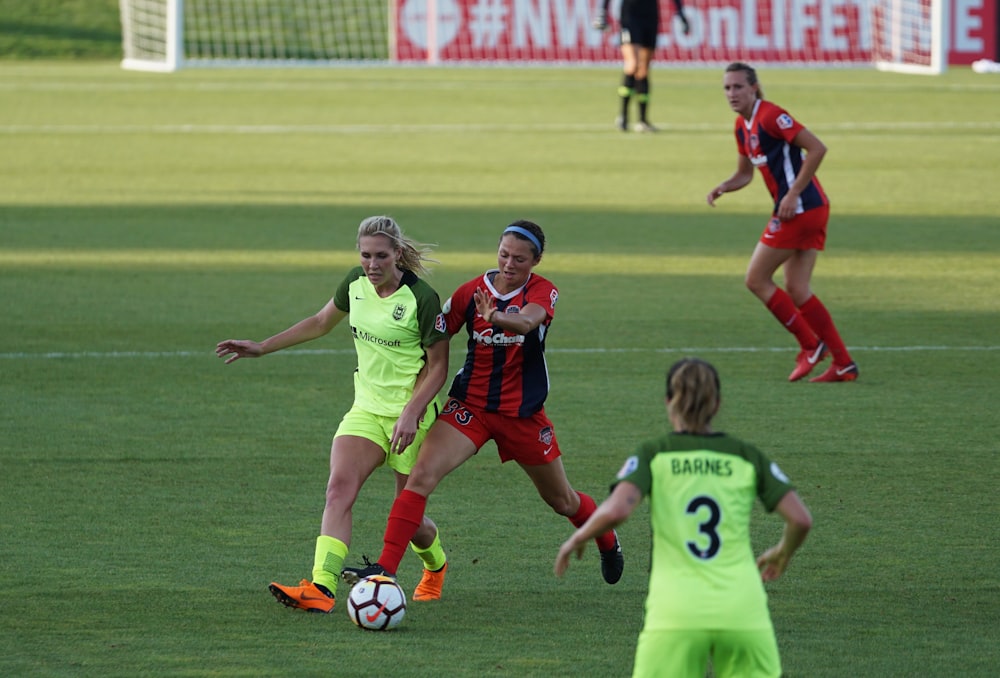 two women playing soccer