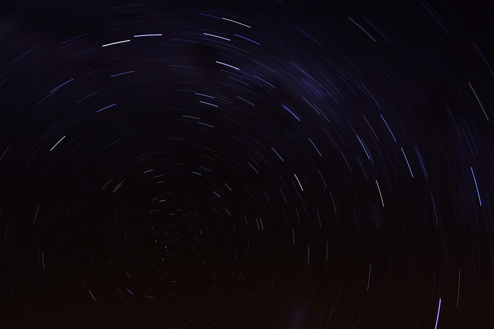 a star trail is seen in the night sky