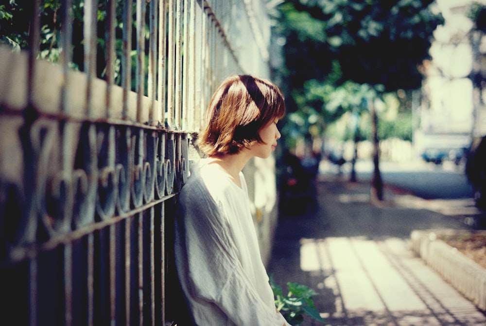 woman lying on black steel wall