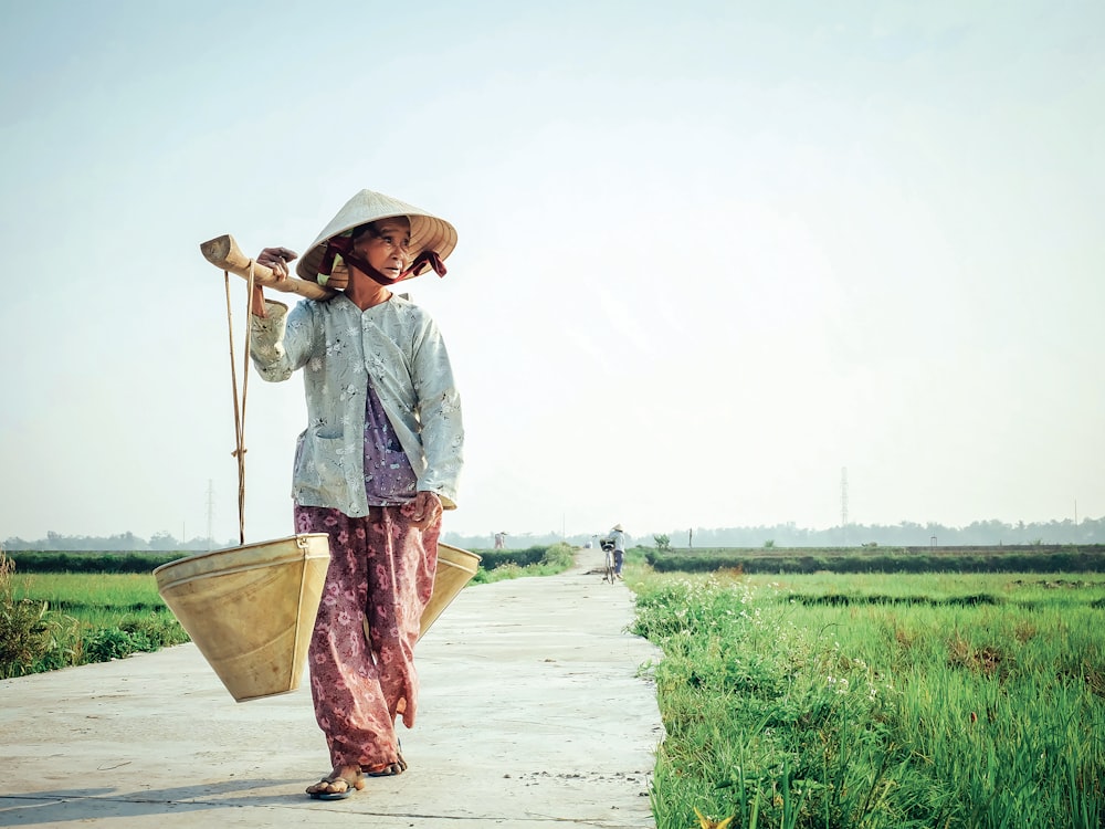 woman carrying basket on her shoulder