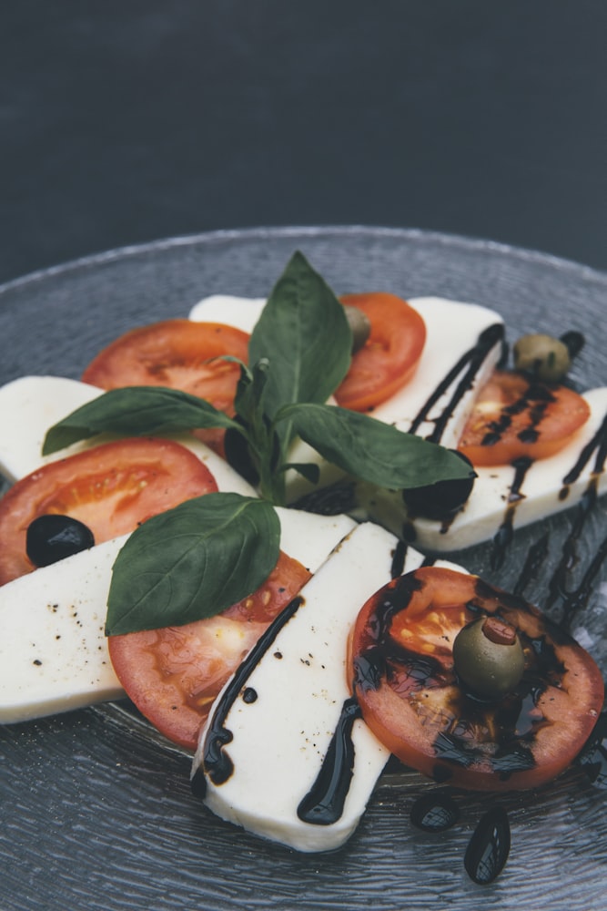 Caprese salad drizzled with balsamic vinegar