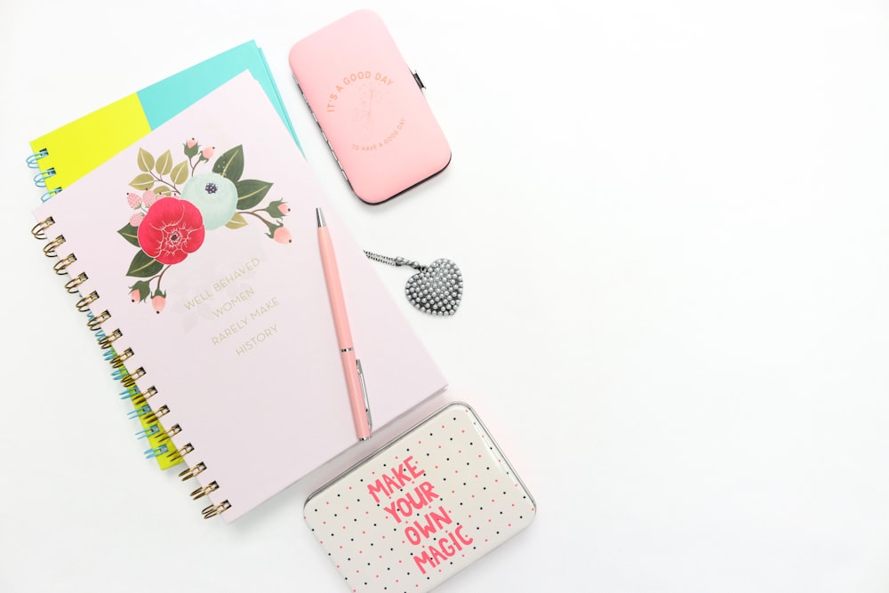 pink notepad with metal cases
