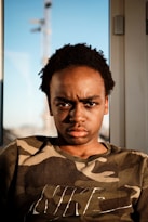 man wearing Nike camouflage t-shirt
