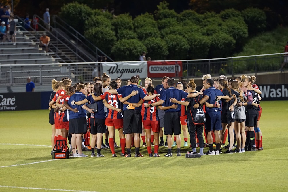 two soccer teams on green field