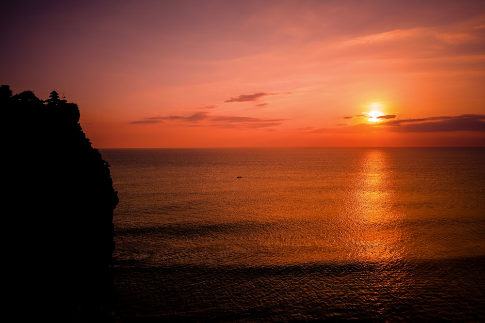 silhouette of seashore mountain