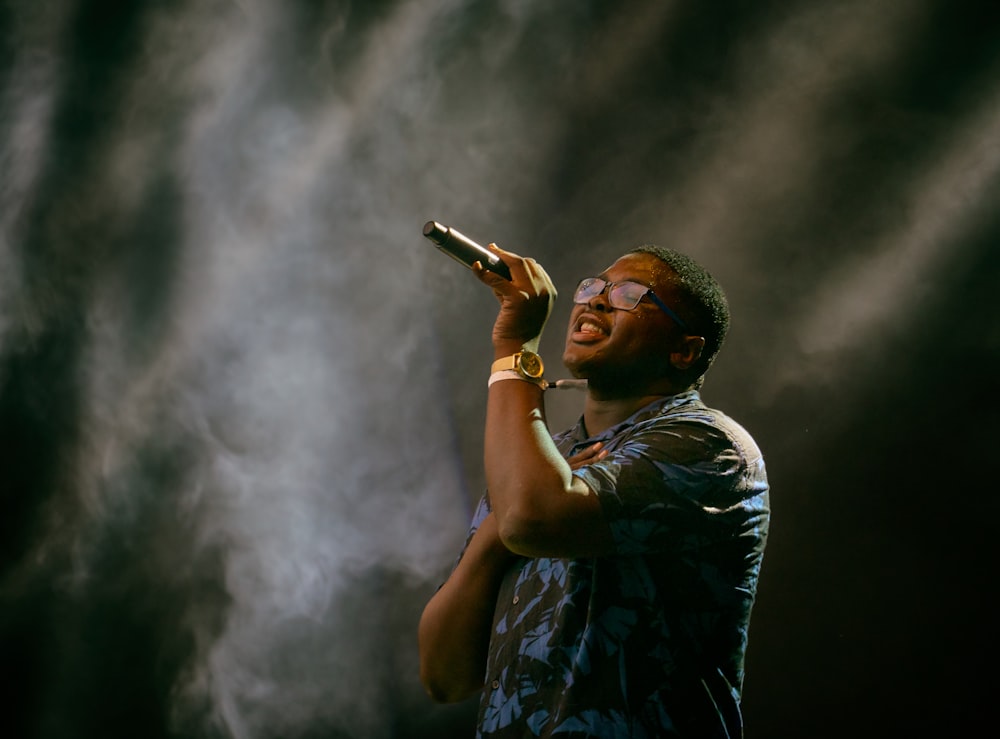 man holding microphone singing