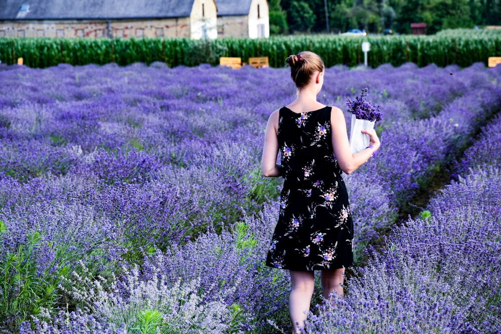 woman walking on purple lavender field