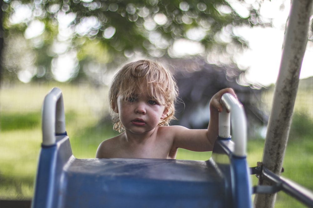 children climbing on slide