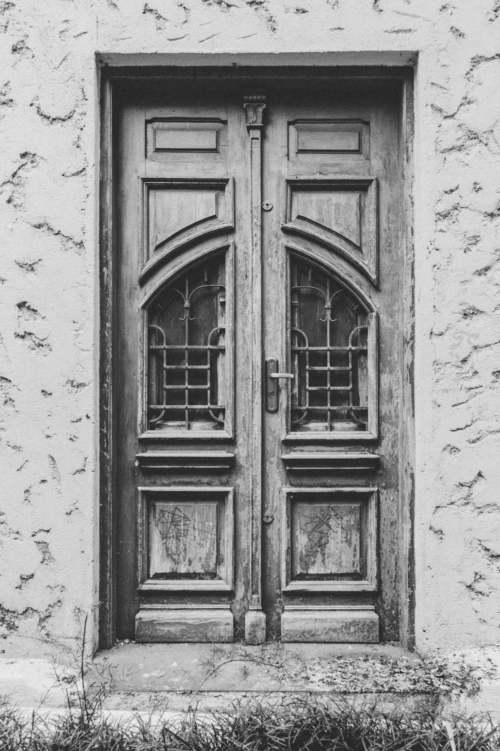 grayscale photo of door