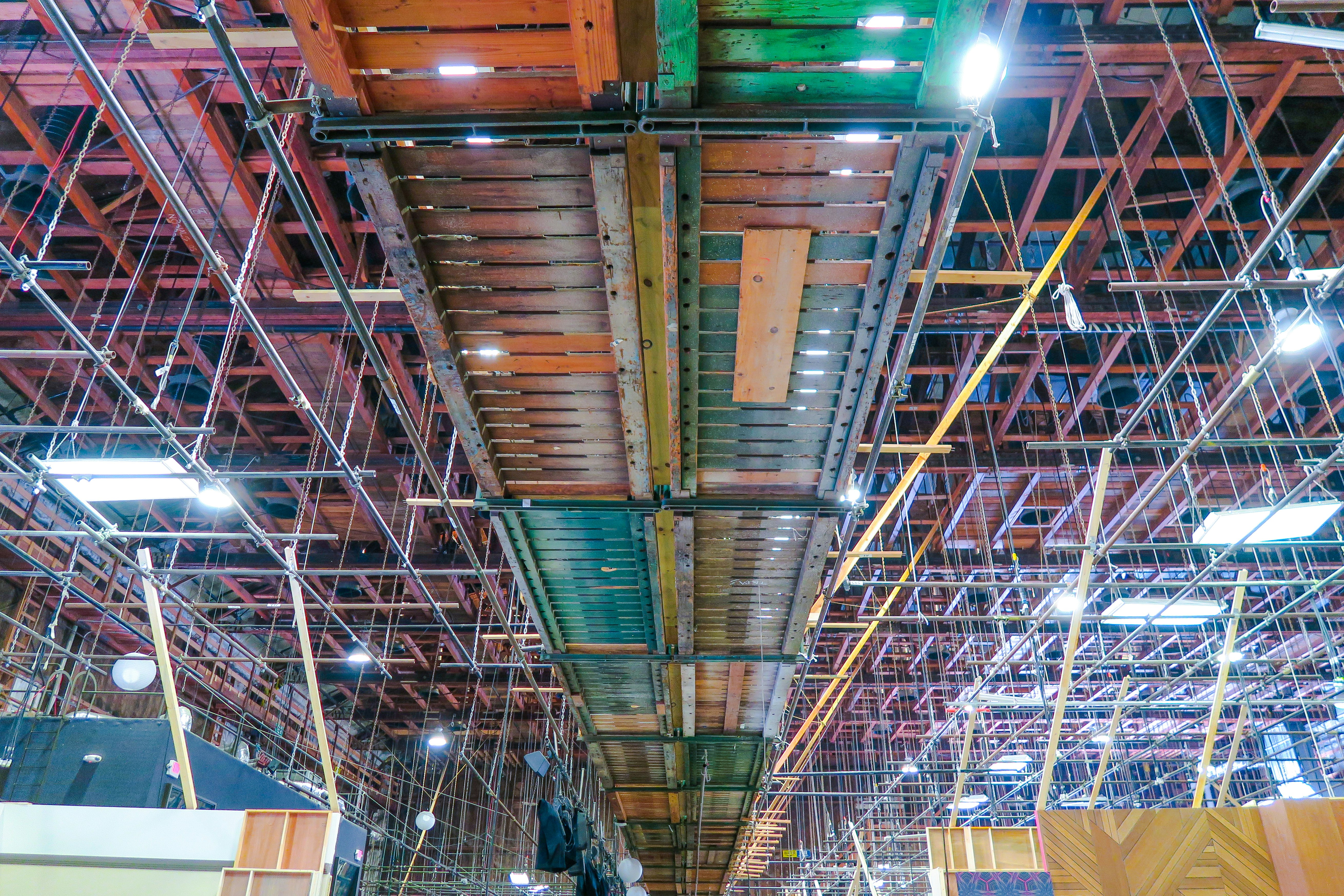 Heavy steel chains and rigging hardware on industrial warehouse floor