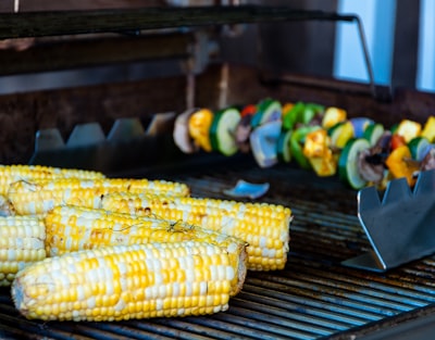 grilled corncobs sweet corn teams background