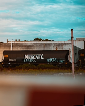 black and white train on rail tracks during daytime
