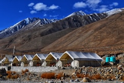 white canopy tents near mountain