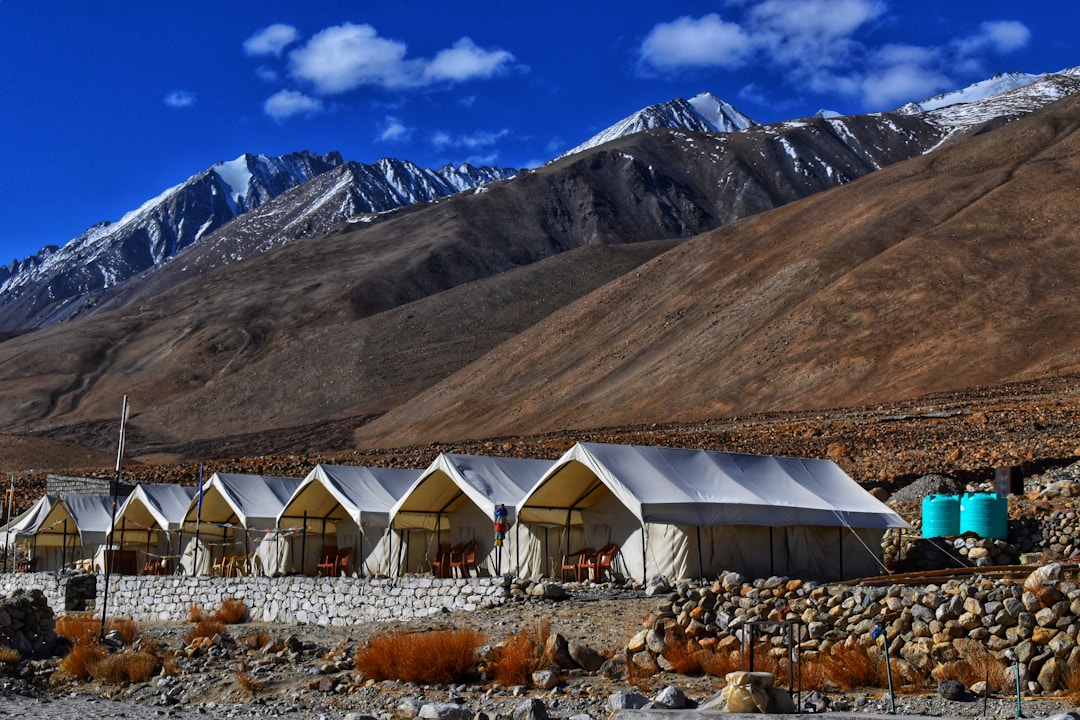 white canopy tents near mountain