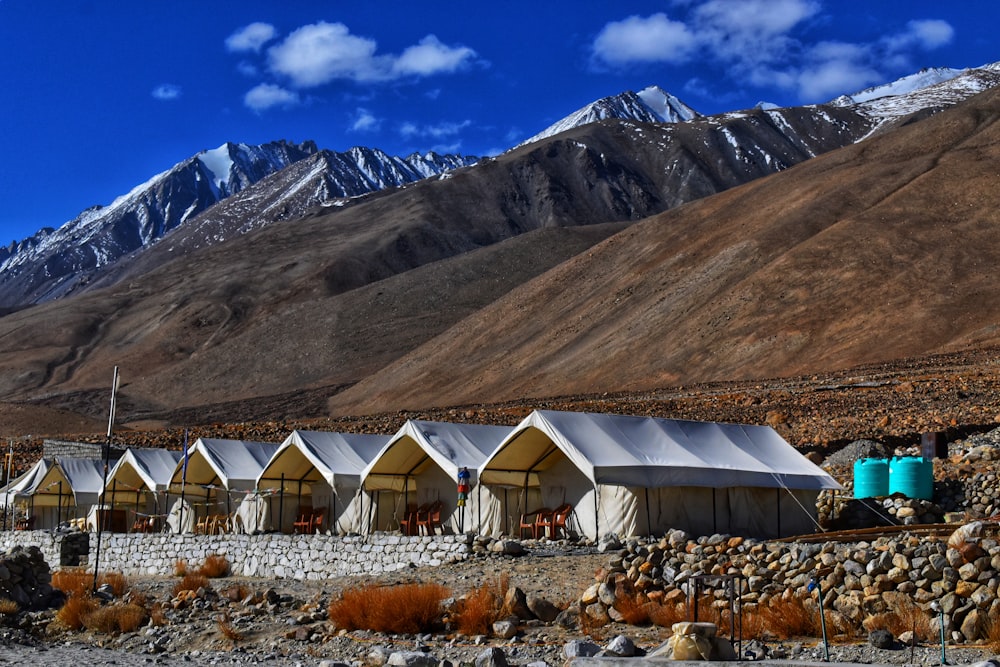 white canopy tents near mountain