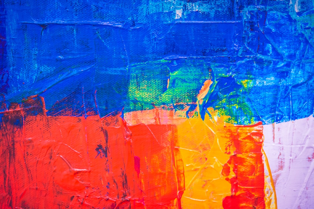 blue, red, pink, and yellow abstract painting