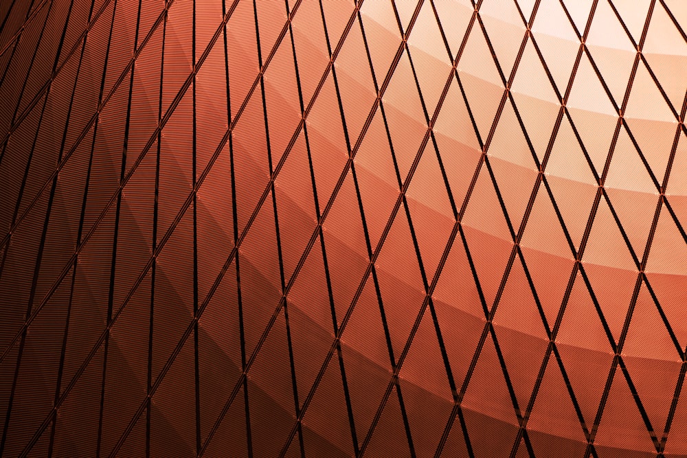 a close up of a fence with a red background