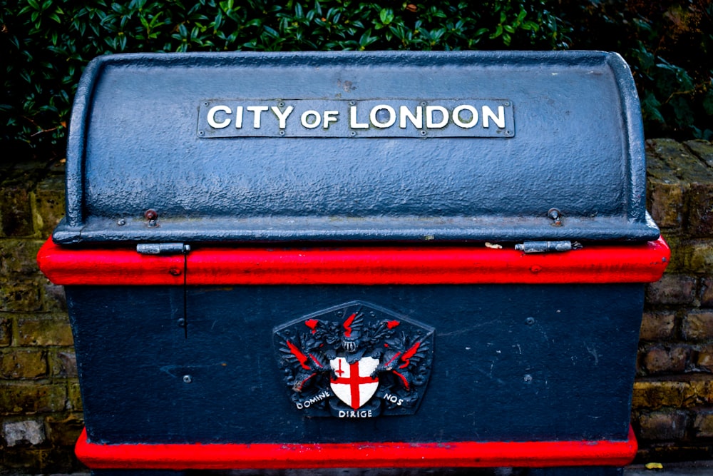 blue and red City of London-printed strongbox
