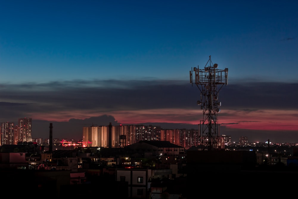 gray metal truss tower during nighttime