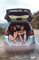 two women in hatchback compartment