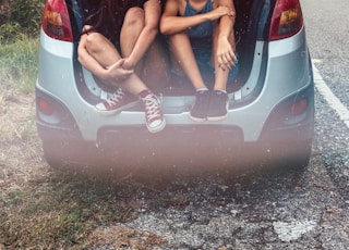 two women in hatchback compartment