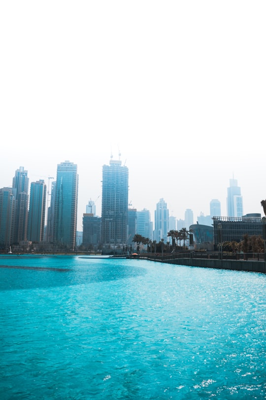 gray city concrete building in The Dubai Fountain United Arab Emirates