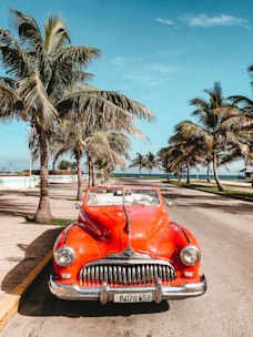 orange car on asphalt road