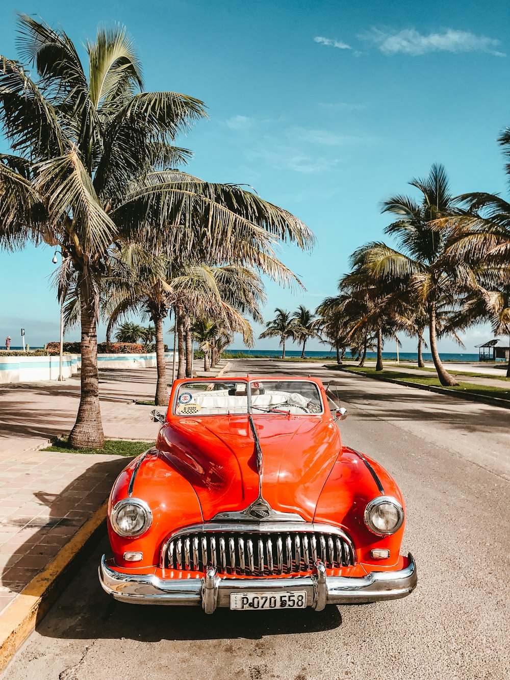 orange car on asphalt road