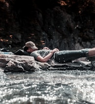 person sleeping on river