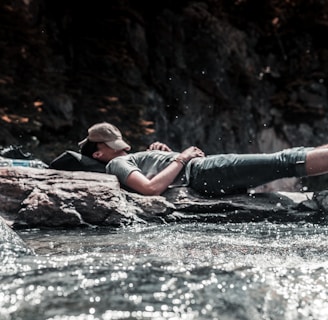 person sleeping on river