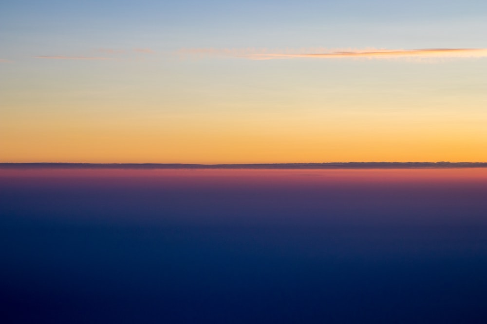 a view of the sky at sunset from an airplane