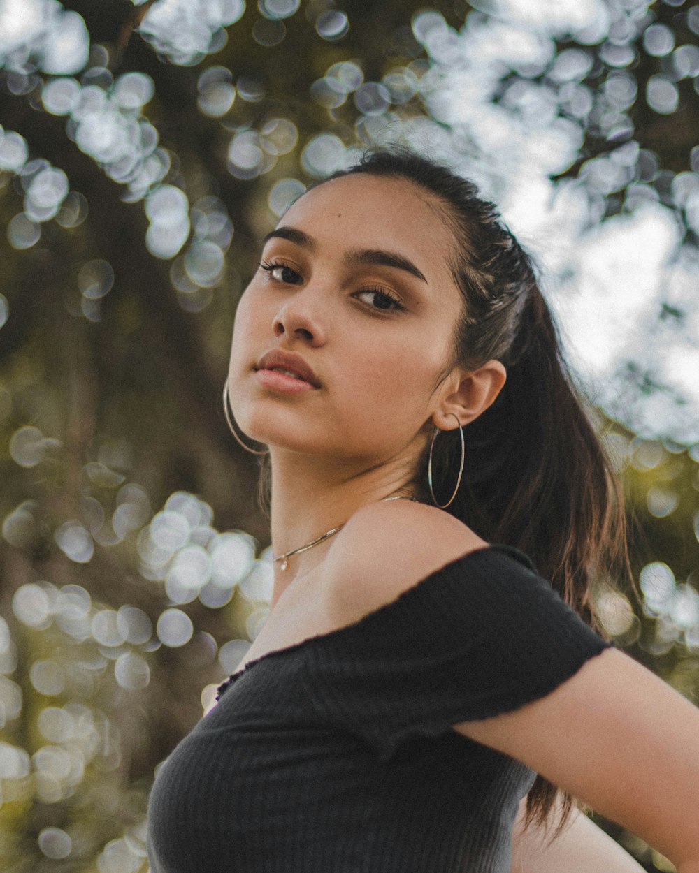 woman in black off-shoulder top