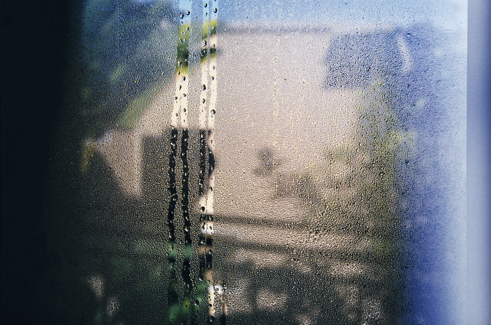 Condensation beading on the inside of a cold window pane