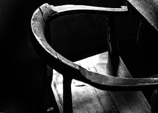 Before and after shots of a vintage wooden chair restored to its original beauty.