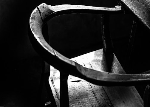 A before-and-after comparison of a stained chair.