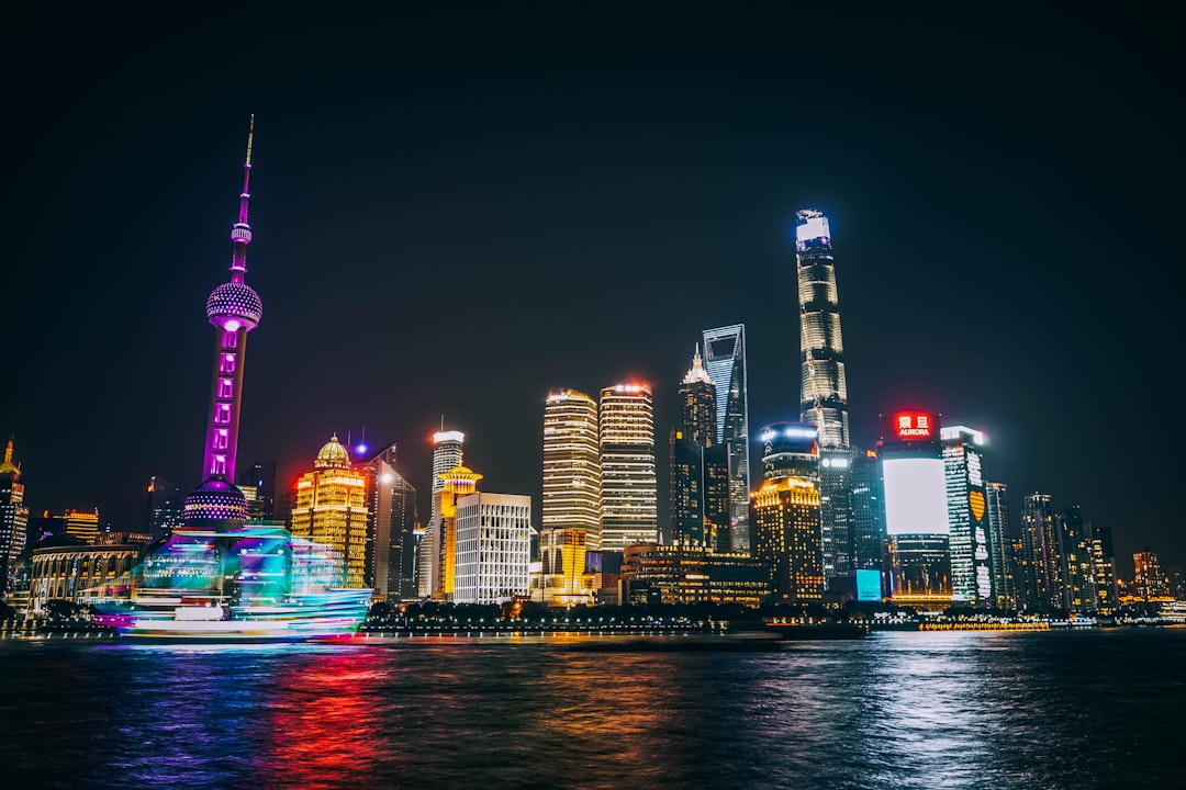 Oriental Pearl Tower and World Financial Center in China, Shot on a windy night at the Bund.