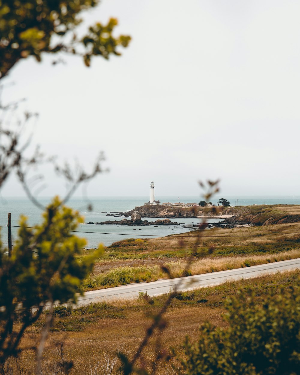 white lighthouse near body of water