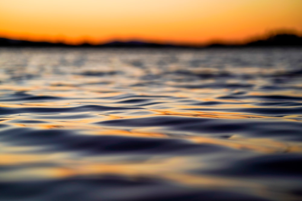 calm water during sunset